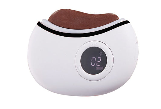 White electronic device with a brown cushion on top, displaying '02' on a digital screen.