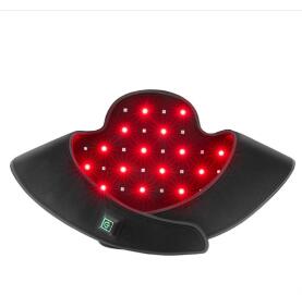 Red LED light pad on a black base with a white background