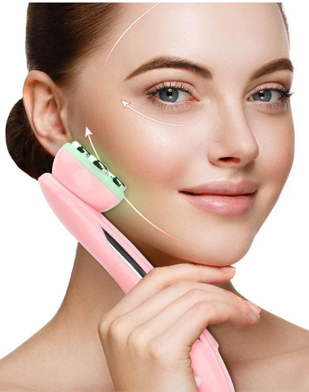 Woman using a pink facial massager on her face with a white background