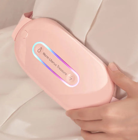 Pink handheld device with a digital display held by a hand on a light background
